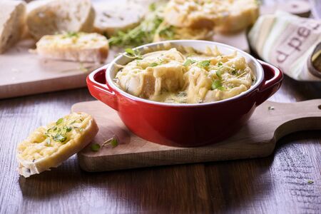 Onion soup served with cheese croutonsの写真素材
