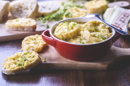 Onion soup served with cheese croutonsの写真素材