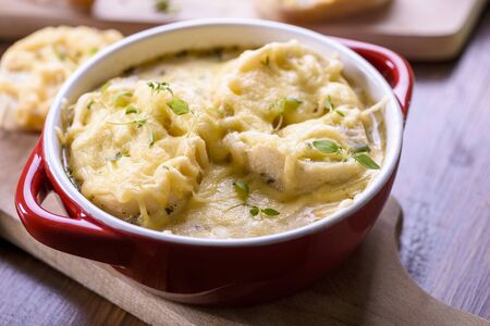 Onion soup served with cheese croutonsの写真素材