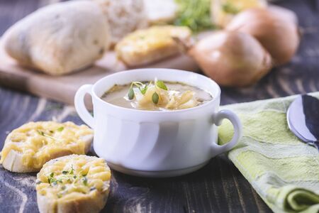 Onion soup served with cheese croutonsの写真素材