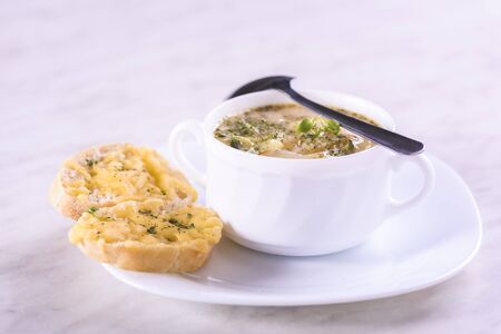 Onion soup served with cheese croutonsの写真素材