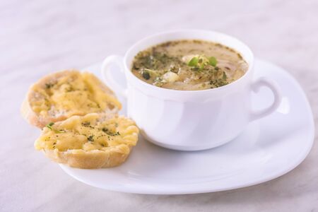 Onion soup served with cheese croutonsの写真素材