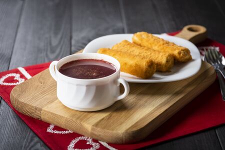Red borscht and croquette with cabbage and mushrooms are festive dishes served for Christmasの写真素材
