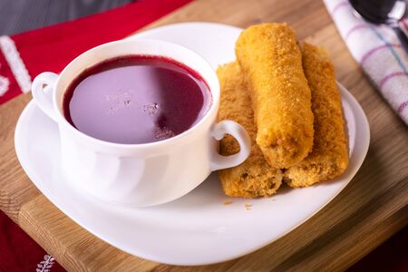Red borscht and croquette with cabbage and mushrooms are festive dishes served for Christmasの写真素材