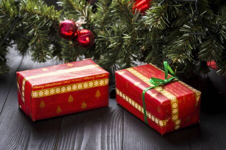 a small box under the christmas treeの写真素材