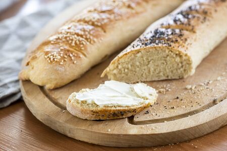 homemade baguette baking with poppy seeds and sesameの写真素材