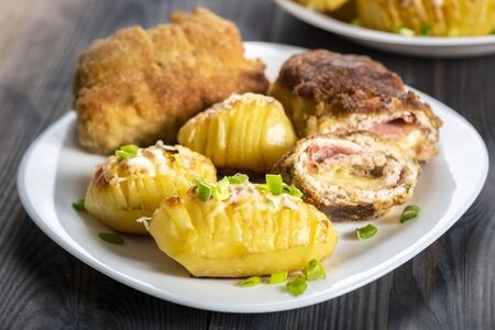 cutlet cordon bleu and hasselback potatoes - a simple and tasty dishの写真素材