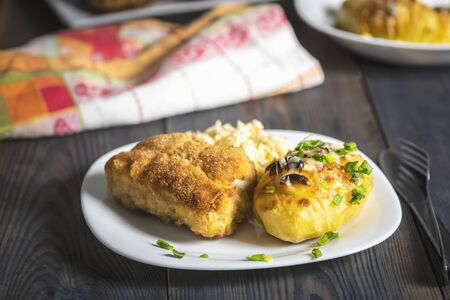 cutlet cordon bleu and hasselback potatoes - a simple and tasty dishの写真素材
