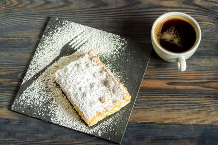 cake with pudding sprinkled with powdered sugarの写真素材