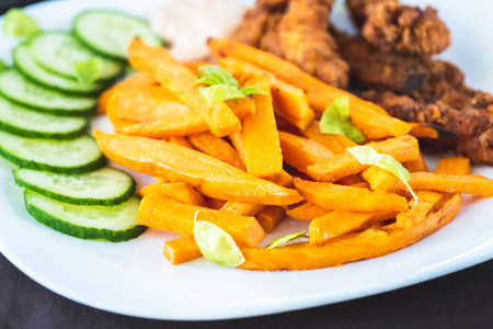 Sweet potato fries and chicken tenderloinの写真素材