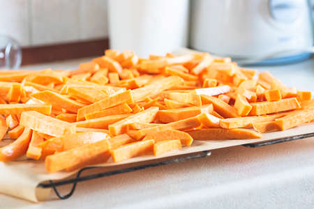 Sweet potato fries before placing in the ovenの写真素材