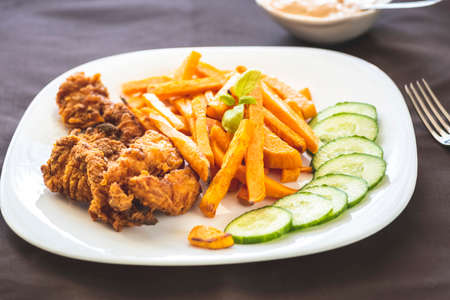 Sweet potato fries and chicken tenderloinの写真素材