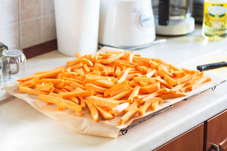 Sweet potato fries before placing in the ovenの写真素材