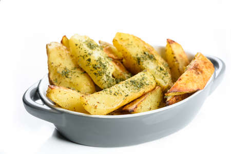 Hawaiian cutlet with baked potatoes and a bouquet of saladsの写真素材