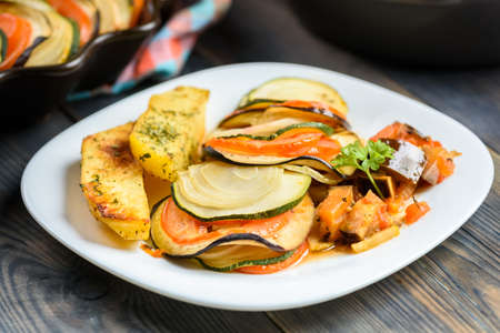 Ratatouille - a dish for vegetarians - served with baked potatoesの写真素材