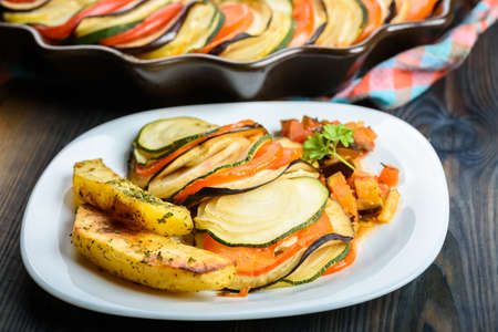 Ratatouille - a dish for vegetarians - served with baked potatoesの写真素材