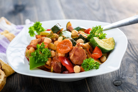 Spanish cauldron - stew with chickpeas, zucchini and chorizo sausageの写真素材