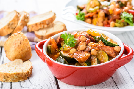 Spanish cauldron - stew with chickpeas, zucchini and chorizo sausageの写真素材