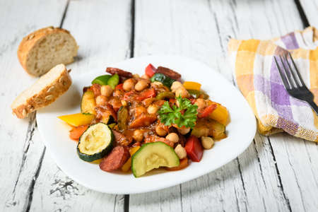 Spanish cauldron - stew with chickpeas, zucchini and chorizo sausageの写真素材