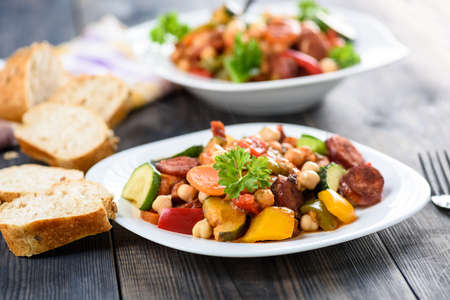 Spanish cauldron - stew with chickpeas, zucchini and chorizo sausageの写真素材