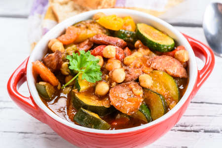 Spanish cauldron - stew with chickpeas, zucchini and chorizo sausageの写真素材