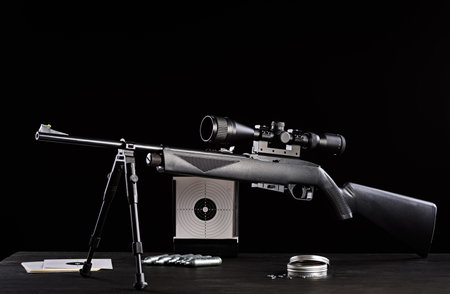 air rifle carabiner on wooden tableの写真素材