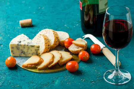 cheese board on a wooden tableの写真素材