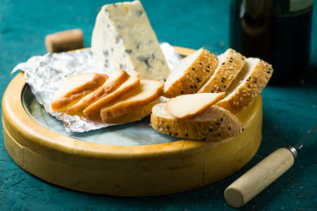 cheese board on a wooden tableの写真素材