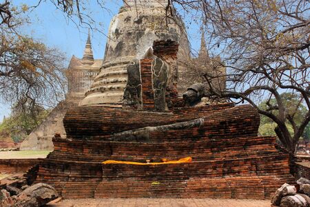 Ancient statue of Buddha in ruins, inside an old temple. Ayutthaya, Thailandの写真素材