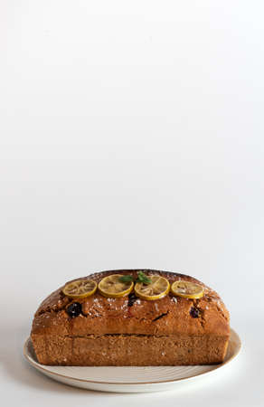 Homemade Lemon and blackberries pound cake. white background.