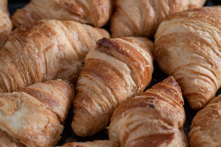 Background of lots of homemade croissants. Bakery. Food texture.の写真素材