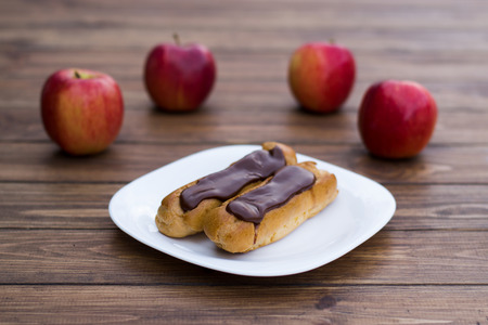 plate of chocolate cake and fresh apples