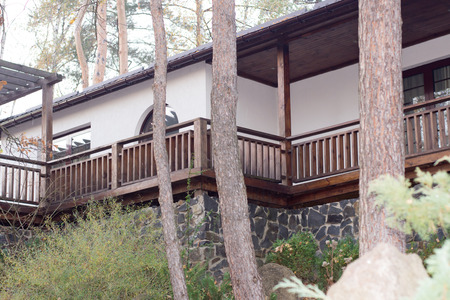 beautiful house in the woods on a stone foundationのeditorial素材