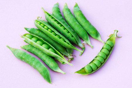 several pods of ripe green peasの写真素材