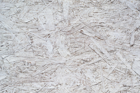 white painted plywood glued of large particlesの写真素材