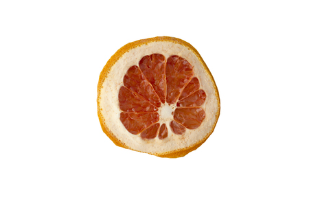 one slice of dried orange close-up on white backgroundの写真素材