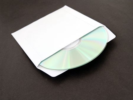 compact disc on black background in white paper envelopeの写真素材