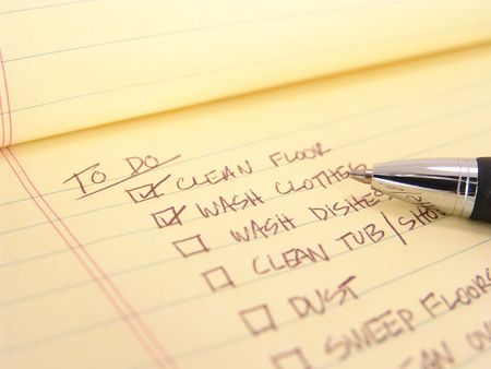 to do list created on yellow legal padの写真素材