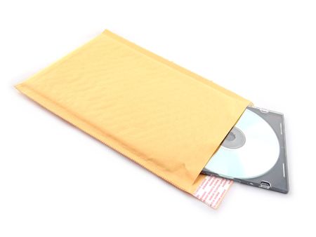manilla bubble mailer with compact disc isolated on whiteの写真素材