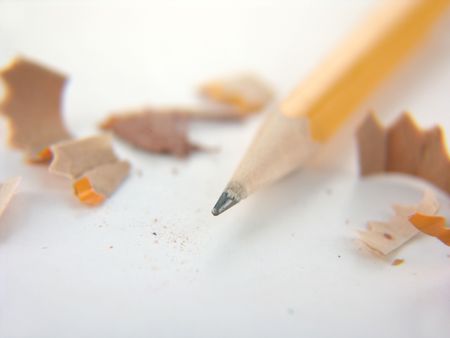 yellow number two pencil with shavings isolated on white background