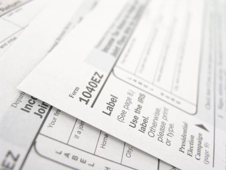 close up of multiple 1040EZ tax forms
