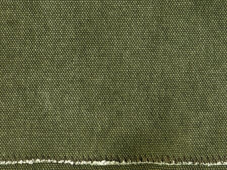 textured green canvas surface with stitchingの写真素材
