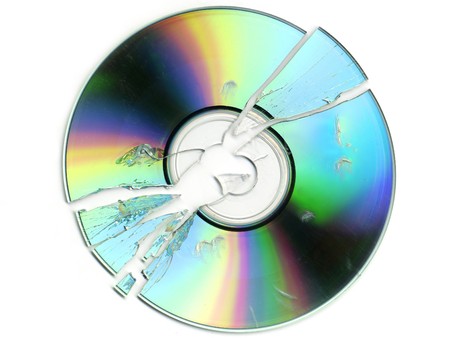 broken and cracked CD / DVD on white backgroundの写真素材