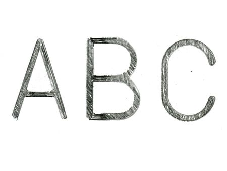 letters created with stencil and pencil on white paperの写真素材