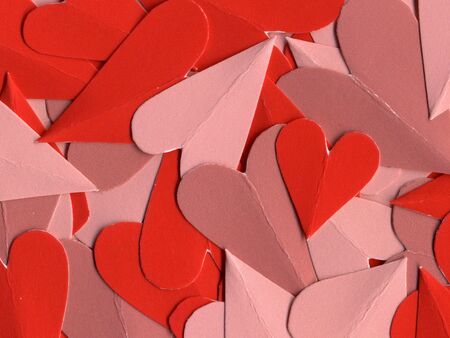 multicolored pink and red hearts cut from paper