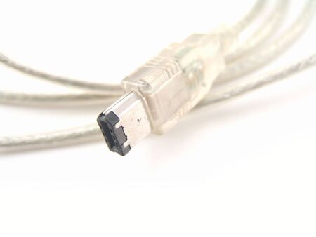 close-up of firewire cable isolated over white backgroundの写真素材
