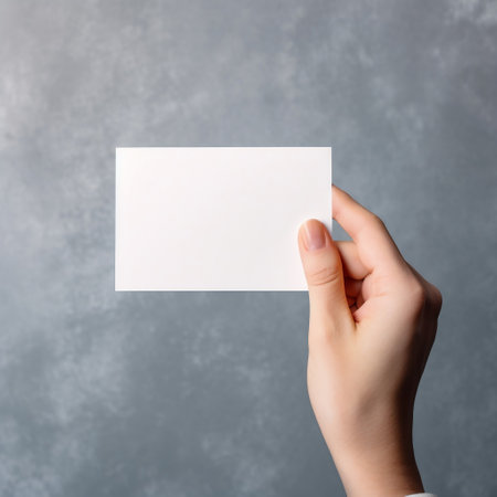 Woman's hand holding a blank white paper card AIの素材