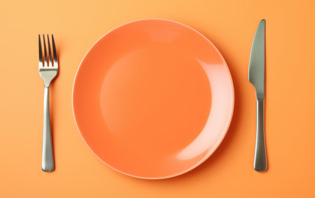 Dine in Style Orange Plate with Cutlery Arrangementの素材