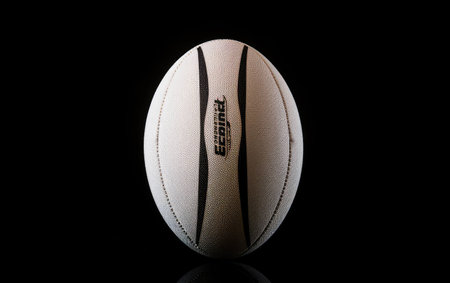 Compact Rugby Ball on Black Background.の素材