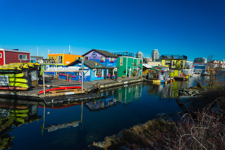 VICTORIA BC CANADA FEB 12, 2019: Victoria Inner Harbour, Fisherman Wharf is a hidden treasure area. With colorful floating homes, gifts, food and wildlife watching eco tours.のeditorial素材